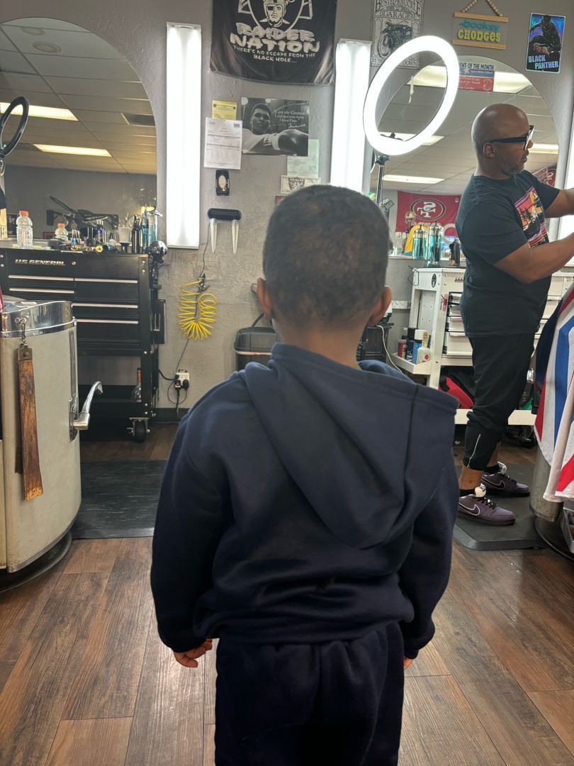 A kid's cut from behind, blended taper